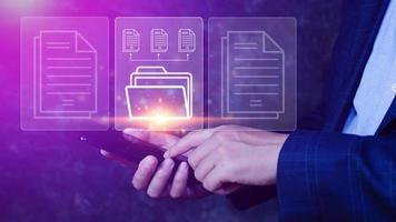Document Management System DMS being setup IT consultant working on smartphone. Software for archiving, searching and managing corporate files information photo