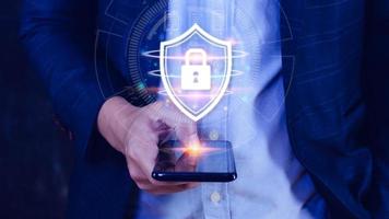 Computer network protection, secure and safe your data concept, businessman holding shield protection icon, Security shield Lock Security Businessman Protect Concept photo