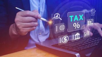 Business using computer to complete Individual income tax return form online for tax payment. Government, state taxes. Data analysis, paperwork, financial research, Calculation tax return. photo