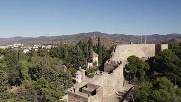 Malaga alcazaba in Spain. Aerial reverse ascending video