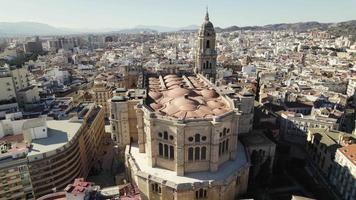 Cathedral of Incarnation in Malaga historic center with cityscape, Spain. Aerial circling video