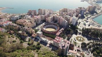 Topdown view Malaga bullring arena surrounded by residential buildings, Spanish coastline. Andalusia video
