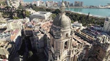 Orbiting Cathedral bell tower revealing beautiful Malaga Coastline, Spain video