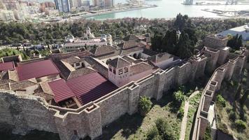 Close aerial pan over ramparts of Alcazaba medieval palace in Malaga video