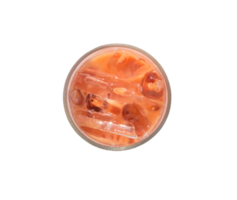 Top view of orange iced condensed Thai milk tea in transparent glass isolated with clipping path in png file format
