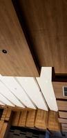 Covering the ceiling of the house with wooden shades photo