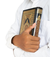 person holding a holy Quran
