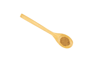 Ground coriander in a wooden spoon isolated png