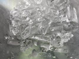 Ice cubes background, ice cube texture or background It makes me feel fresh and feel good, In the summer, ice and cold drinks will make us feel relaxed, Made for beverage or refreshment business. photo