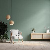 Interior mockup green wall with gray armchair and decor in living room. photo