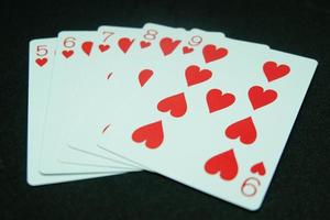 Heart Straight Flush ,Any sequence all the same suit, for instance 9-8-7-6-5 in black background photo