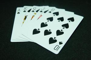 Spade Royal Flush ,All the same suit, sequence A-K-Q-J-T in black background photo