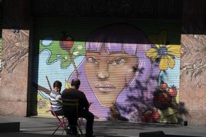 MEXICO CITY, MEXICO - JANUARY 30 2019 - All the shops roll down gates have spray painted graffiti photo