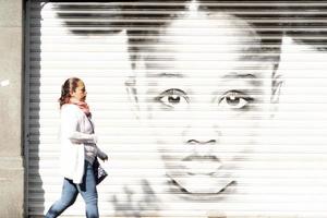 MEXICO CITY, MEXICO - JANUARY 30 2019 - All the shops roll down gates have spray painted graffiti photo