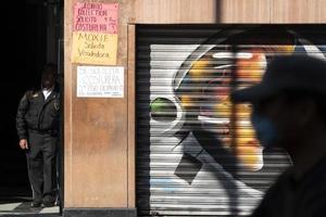 MEXICO CITY, MEXICO - JANUARY 30 2019 - All the shops roll down gates have spray painted graffiti photo