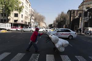 MEXICO CITY, MEXICO - JANUARY 30 2019 - All the shops roll down gates have spray painted graffiti photo