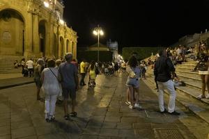 NOTO, ITALY - JULY 19 2020 - No social distancing in the street after covid coronavirus photo