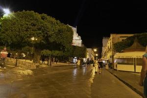 NOTO, ITALY - JULY 19 2020 - No social distancing in the street after covid coronavirus photo