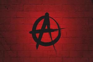 Flag of Anarchist painted on a wall photo