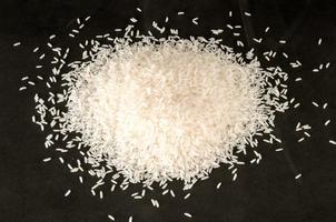 White rice on black background photo