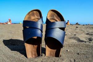 Sandals in the sand photo