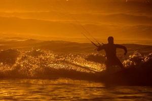 Kitesurfer at sunset photo