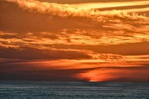 Sunset over the sea photo