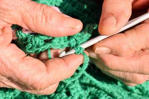 Woman knitting fabric photo