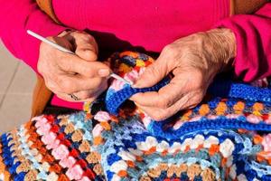 Woman knitting fabric photo
