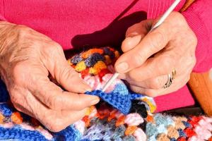 Woman knitting fabric photo