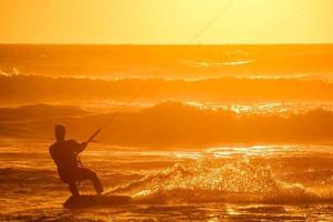 Kitesurfer at sunset photo