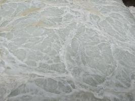 Texture and surface of seawater fall on the power plant with foaming on the outfall. The photo is suitable to use for industry background, environment poster and nature content.