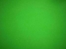 green velvet fabric texture used as background. Empty green fabric background of soft and smooth textile material. There is space for text.. photo