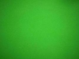 green velvet fabric texture used as background. Empty green fabric background of soft and smooth textile material. There is space for text.. photo