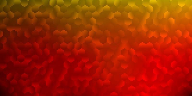 Light red, yellow vector backdrop with a batch of hexagons.