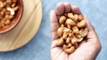 Close up of holding many cashew nuts video
