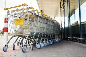 Row of empty shopping cart near a shop, close up photo