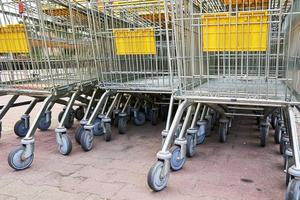 Row of empty shopping cart near a shop, close up photo