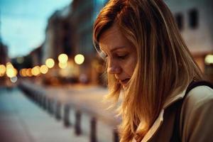 Woman at night city street photo