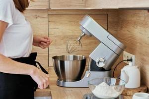 Woman cooking homemade cake photo