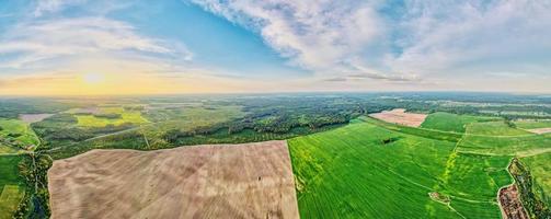 Aerial view of agricultural and green fields in countryside photo