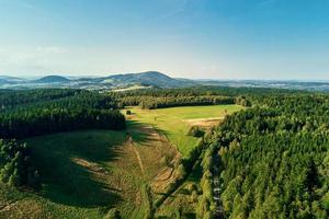 Mountains and green fields, aerial view. Panorama of beautiful landscape photo