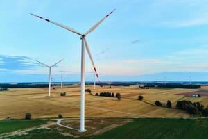 Wind turbine in the field. Wind power energy concept photo