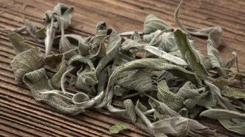 Dry leaves of sage salvia on a wooden board video