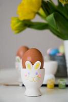 bunny shaped Easter egg holder. vertical card for holidays photo
