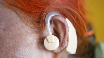 Hearing aid concept, a senior woman with hearing problems video