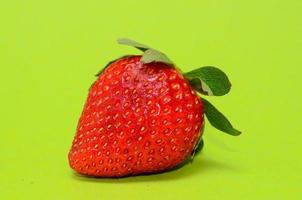 Strawberry on green background photo