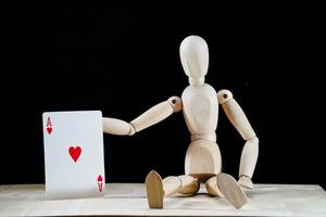 Wooden mannequin on dark background photo