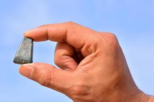 Holding small gemstone photo