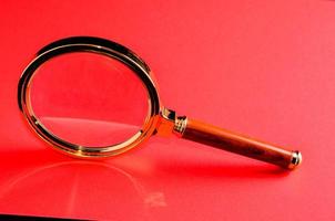Gold magnifying glass photo